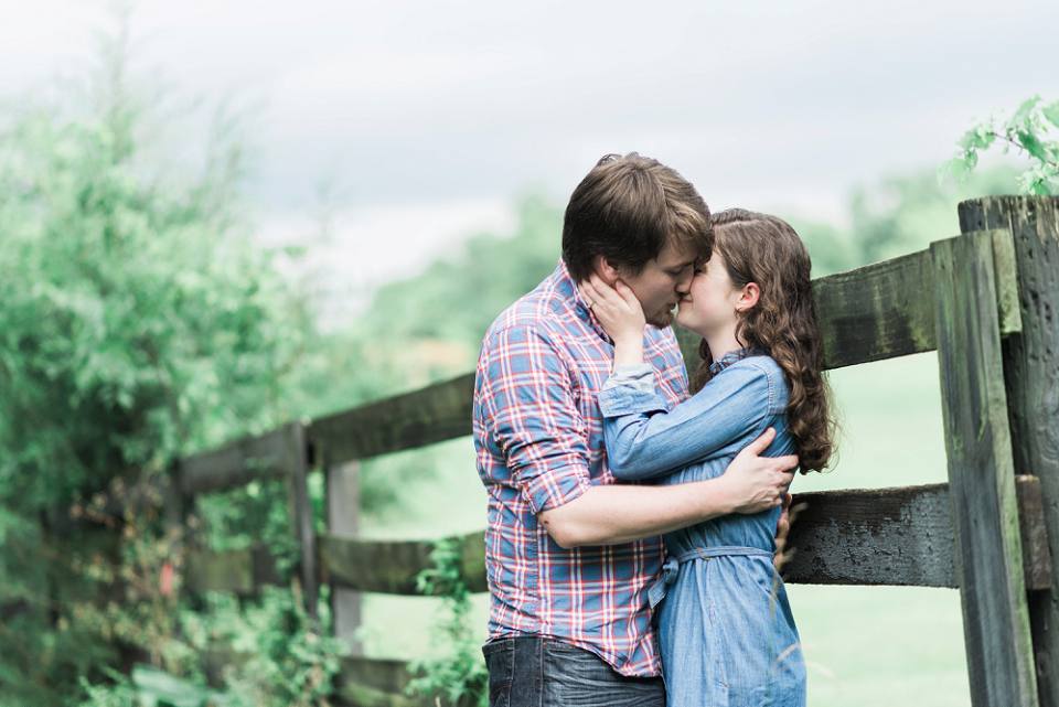 Natural engagement session by fence in Smith Park Brentwood TN
