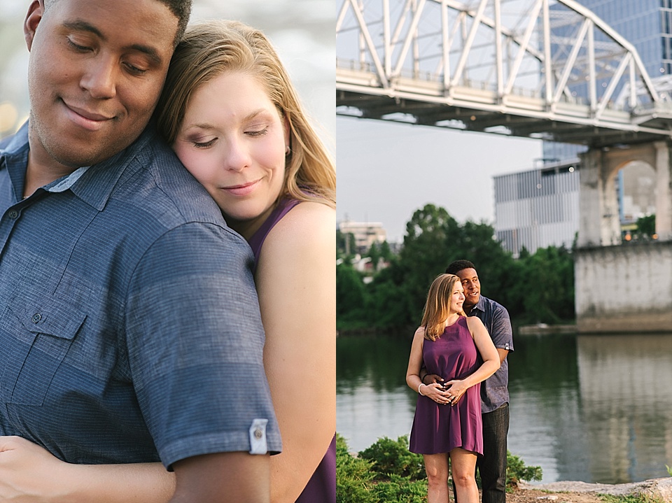 Couple hugging Nashville pedestrian bridge engagement session