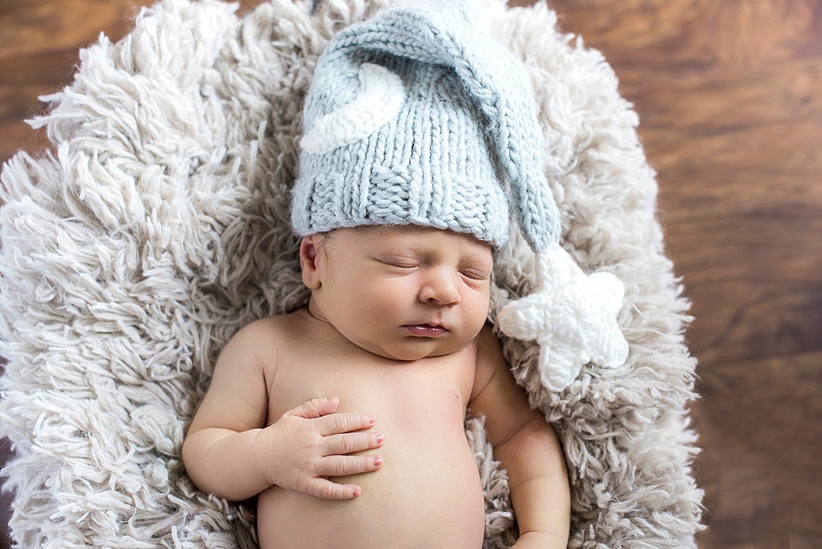 newborn baby with blue hat