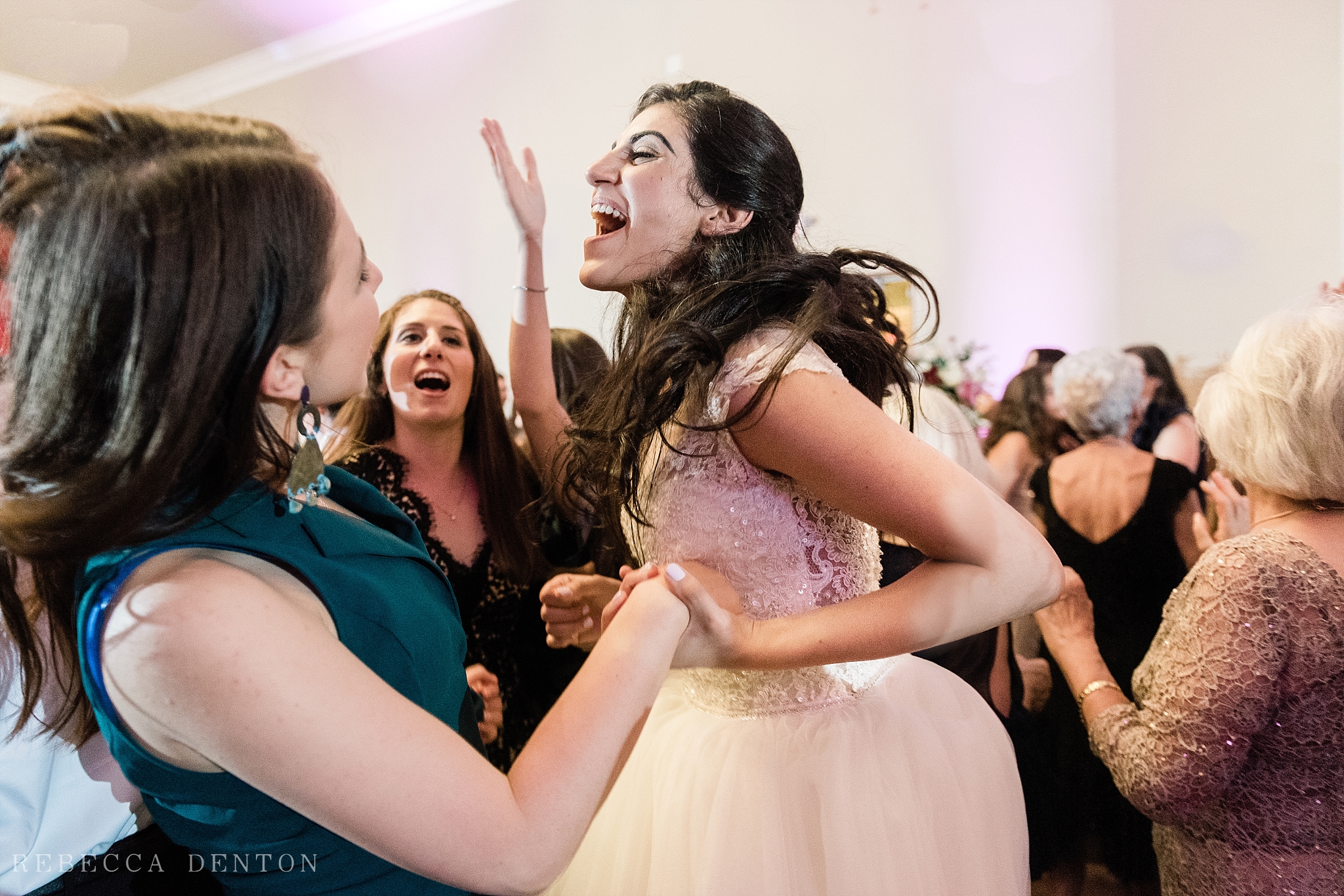 Bride dancing Jewish wedding reception