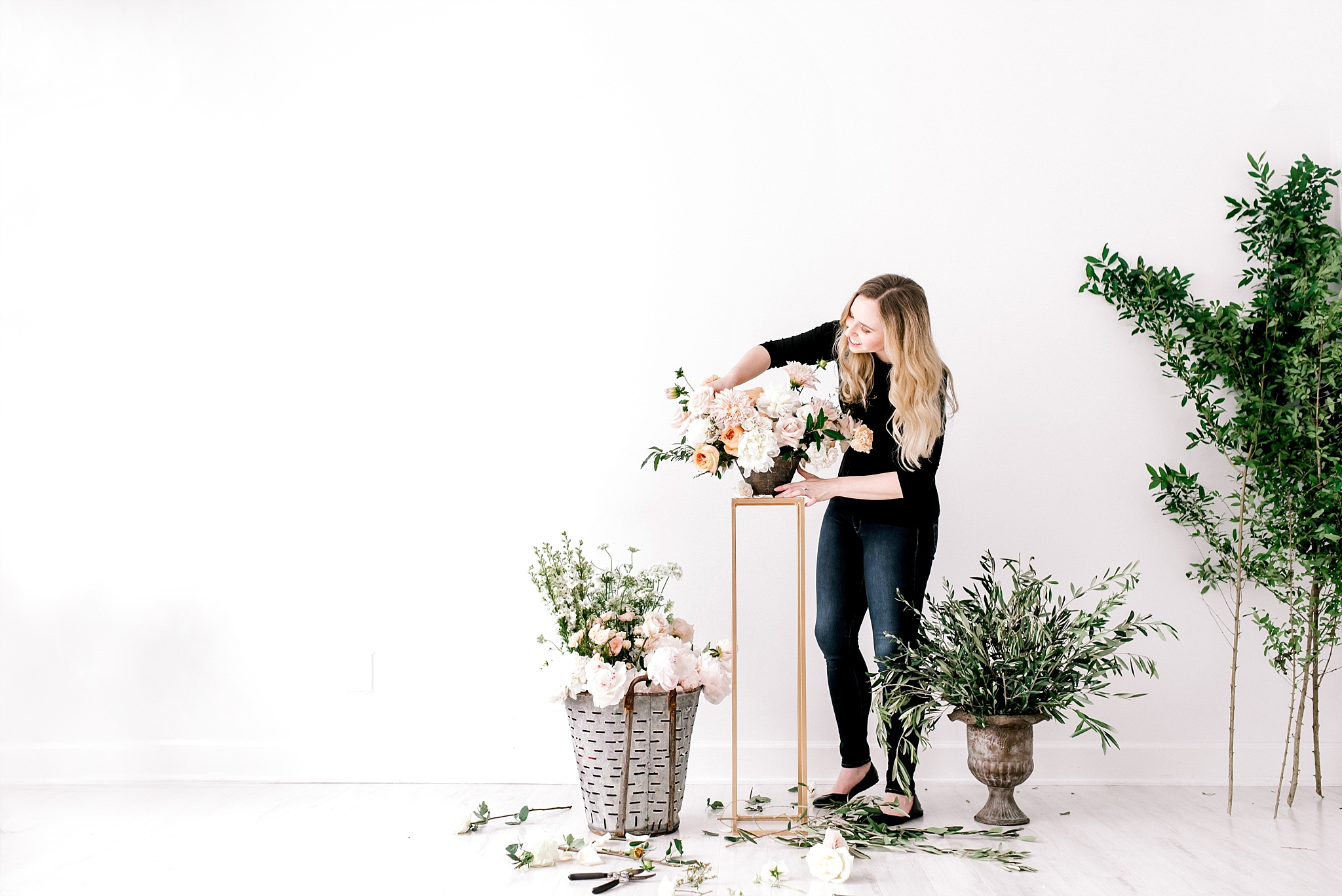 Wedding florist arranging flowers