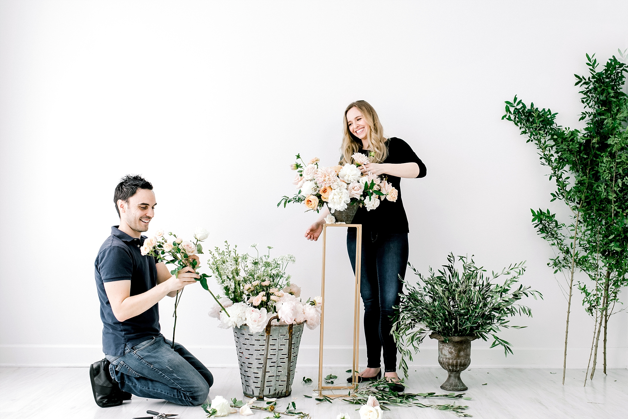 Husband and wife florist team arranging flowers