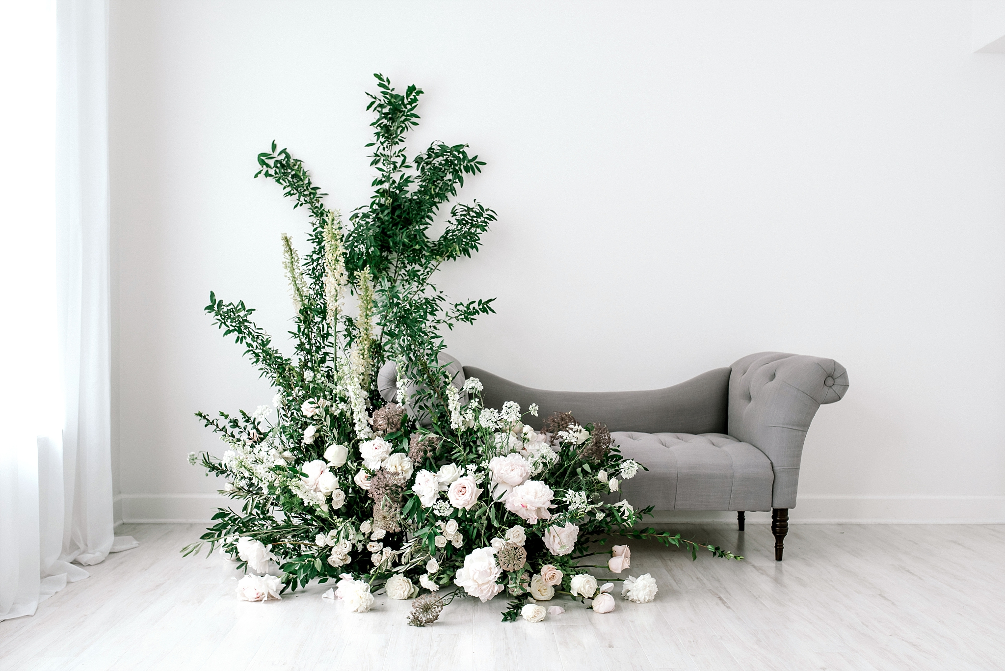 Greenery and white roses floral installation