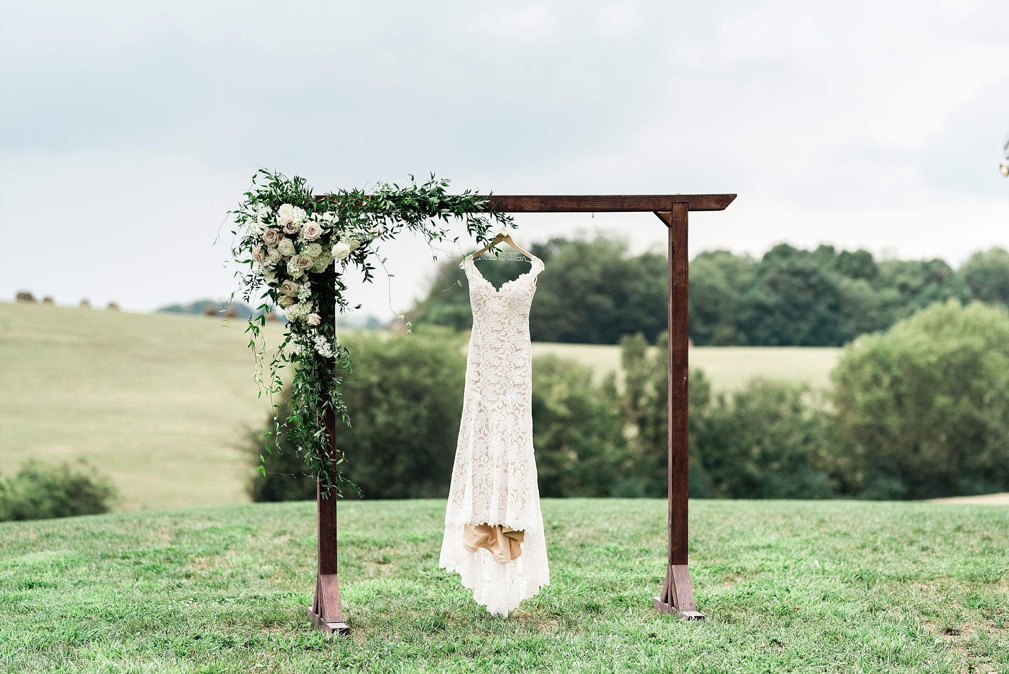 Wedding flowers outdoor arch Enchanted Florist