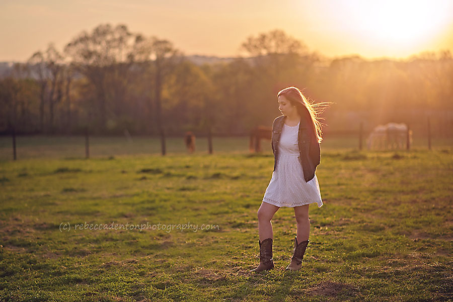 Madeline stands in a field at a horse farm in Nashville