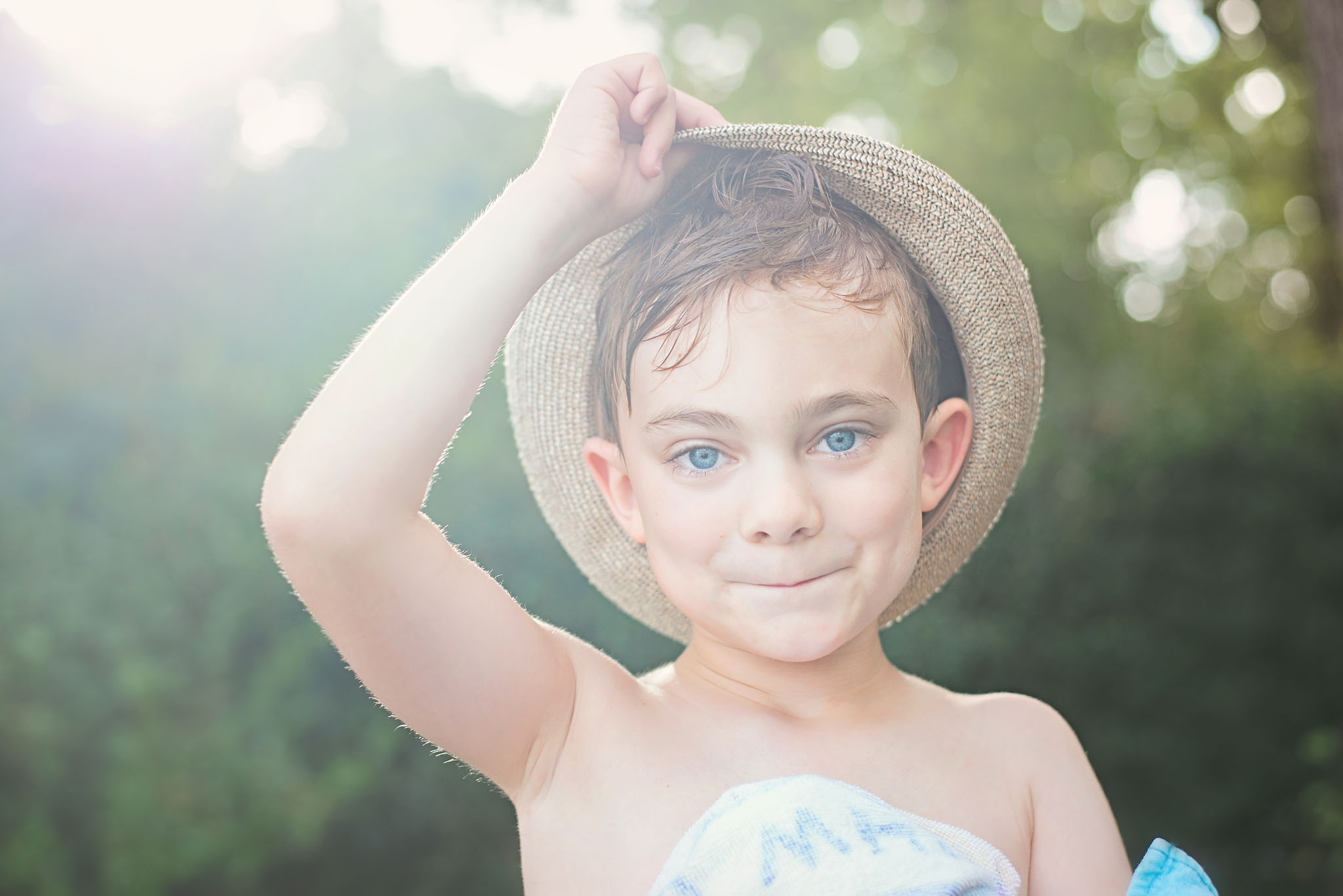 boy with hat in sun