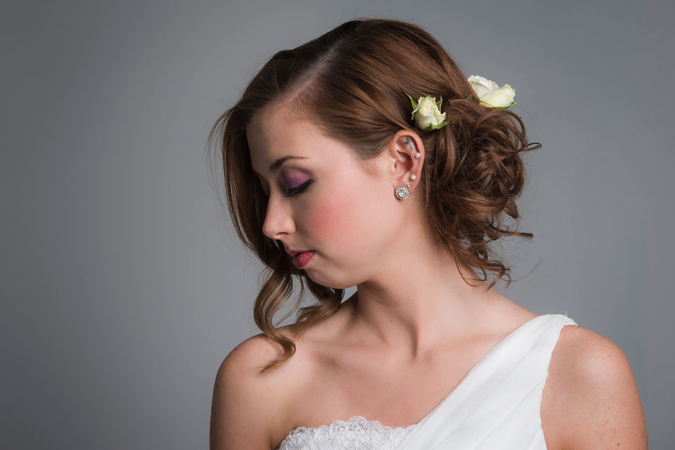 Bridal portrait romantic upswept hair with flowers