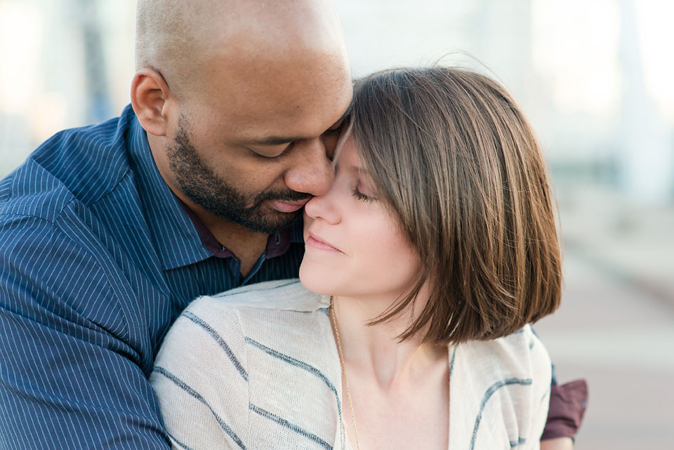 Couple embracing in downtown Nashville engagement photography