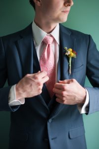 Groom blue suit with pink tie